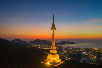 aerial view scenery sunset above pagoda of Doi Thepnimit temple on the highest of Patong...