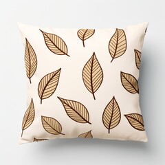 a brown and white leaf pillow on a light colored surface