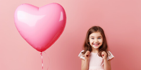 Fototapeta na wymiar little girl holding pink heart shaped balloon on pink banner. Valentine's day concept