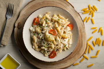Macaroni cooked with cream, cheese and baked cauliflower.