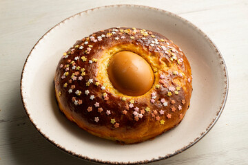 Mona de Pascua, sponge cake with boiled egg. Traditional Spanish dessert for Holy Week