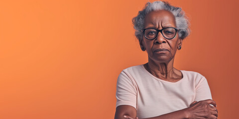 Grumpy senior black woman looking at camera with resentment and disapproval, on solid background with copy space. - obrazy, fototapety, plakaty