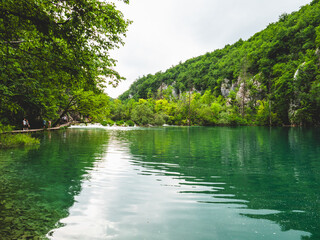 Scenic view of lush green forest and a serene river in Plitvice Lakes National Park, Croatia