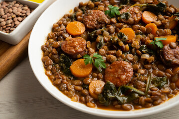 Lentil stew with chorizo and carrot. Traditional Spanish recipe.