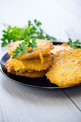 fried vegetarian potato pancakes in a plate.