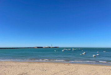 Sea with boats near Cadiz in Spain on a sunny day - 734912339