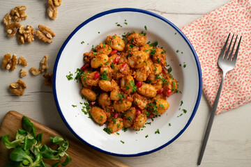 Gnocchi with pesto rosso sauce. Italian potato gnocchi with traditional sauce.