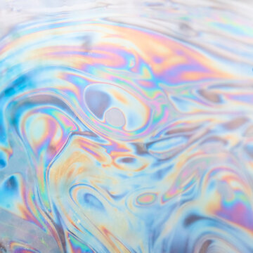 Iridescent soap film patterns with vibrant swirls