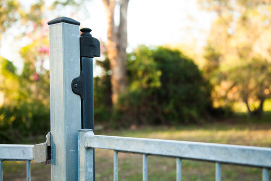 Self closing pool gate with child proof latch to open