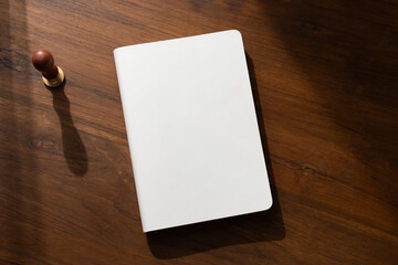 top view blank white book cover mockup on wooden background. with clipping path