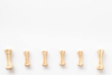 Dog food and treats - chew bones pattern, top view