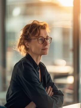 Serious middle-aged German woman in her office
