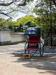 Rickshaw cart at the entrance to Marugame castle - Kagawa prefecture, Japan