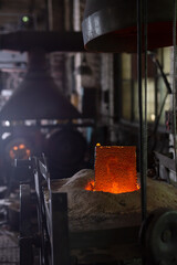 Ferrous metal billet is melted in an induction furnace closeup
