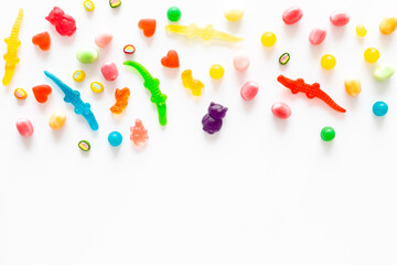 Flat lay of colorful candies and lollipop. Sweet food and candies background