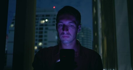 Nightly man habit of scrolling news on phone sign of internet dependency Scrolling becomes way to cope with urban stress. Endless scrolling cycle of stress and restlessness face in close-up.