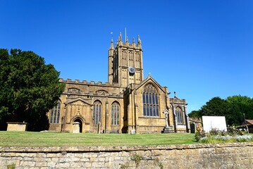 Front view of St Marys Minster Church in the town centre with the graveyard in the foreground, Ilminster, Somerset, UK, Europe. - 734962991