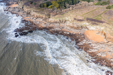 Beautiful landscape from the drone of the French rocky coast by the ocean in Brittany.