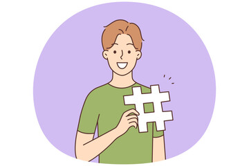 Smiling man with hashtag sign