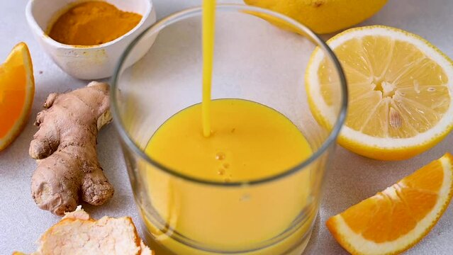 Immune boosting drink. Ginger, orange, turmeric shot, healthy juice drink