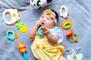 Fototapeta premium Baby in cute outfit with toys,Little girl 3-6 months old in cute outfits