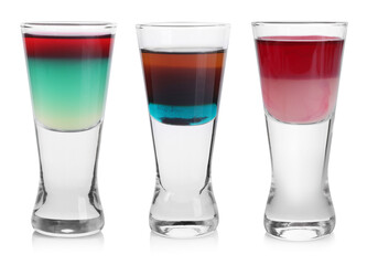 Different shooters in shot glasses isolated on white, set