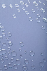 Water drops on grey background. Space for text
