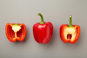 Red sweet pepper on grey background. Space for text. Flat lay