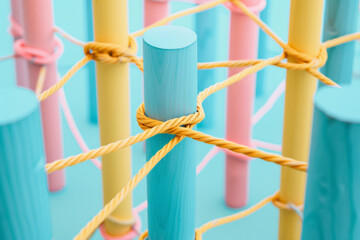 A wooden peg connected with string. Communication, technology, network concept