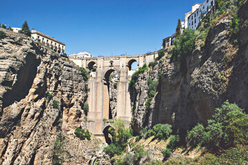 Fototapeta premium Ronda, Spain. Aerial evening view of New Bridge over Guadalevin River in Ronda, Andalusia, Spain. View of the touristic city.