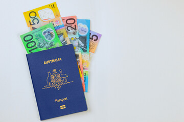 Money Australian currency dollars cash banknotes in Australian passport on white background