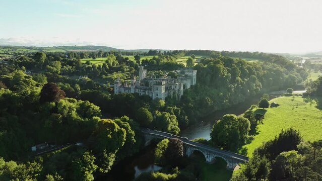 Castle near an ancient bridge over a picturesque river in 4k