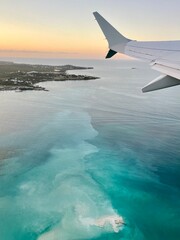 view of the turquoise Caribbean sea from airplane 