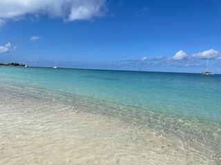 Fototapeta na wymiar Antigua beach with sky Dickenson Bay