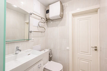 Fototapeta na wymiar interior apartment room bathroom, sink, decorative elements, toilet. WC, sanitary unit, wash room
