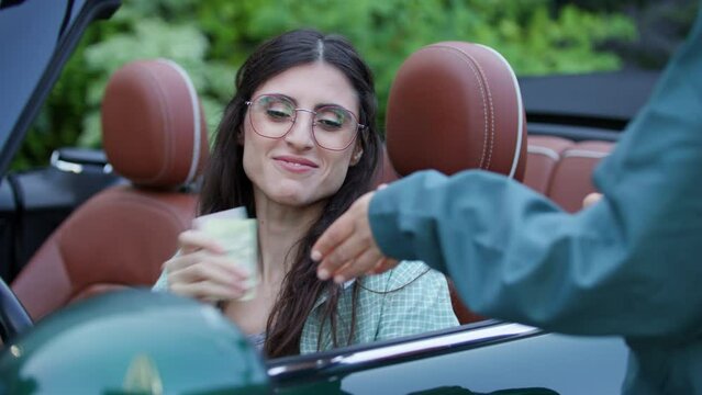 Female Driver Giving Documents to Police Officer sitting in Car. Road inspector checking driving licence. 4K