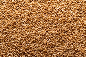 brown sesame in a close-up, a pile of brown sesame seeds