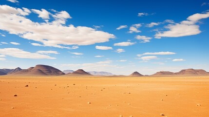 The most beautiful landscape of Africa, an empty desert against a blue sky with rare white clouds...