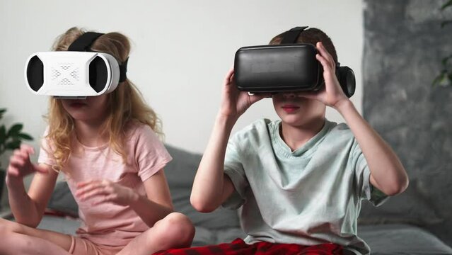 Children, a boy and a girl, play games in virtual reality and actively share their impressions and emotions.