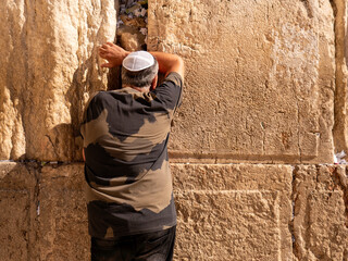 Jew prays near the wailing wall, the person on the wall of the fortress. Jerusalem , Israel 