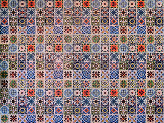 Closeup of Beautiful Colorful vintage ceramic tiles patterns wall decoration for interior home or rustic ceramic wall tile design at Thailand.