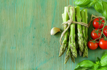organic fresh green asparagus on wooden table