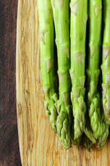 organic fresh green asparagus on wooden table