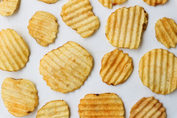 delicious potato chips isolated white