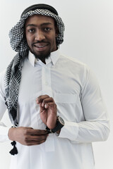 Arabic entrepreneur captures a self-portrait against an isolated white background, radiating...