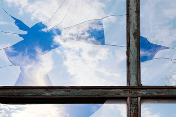 Sky through a broken window. Broken glass