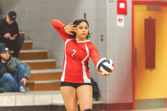 teen volleyball player in gymnase play her sport - Powered by Adobe