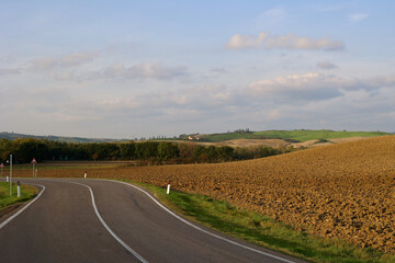 Italy, Tuscany. The country empty road at sunset. 