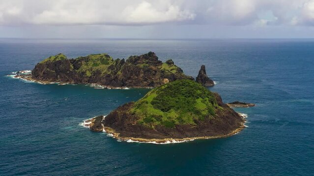 Aerial drone of tropical island and blue sea. Dos Hermanos Island. Santa Ana, Cagayan. Philippines.