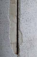 Close-up of The building's large cement pillars have cracks background for design and decoration at Thailand.